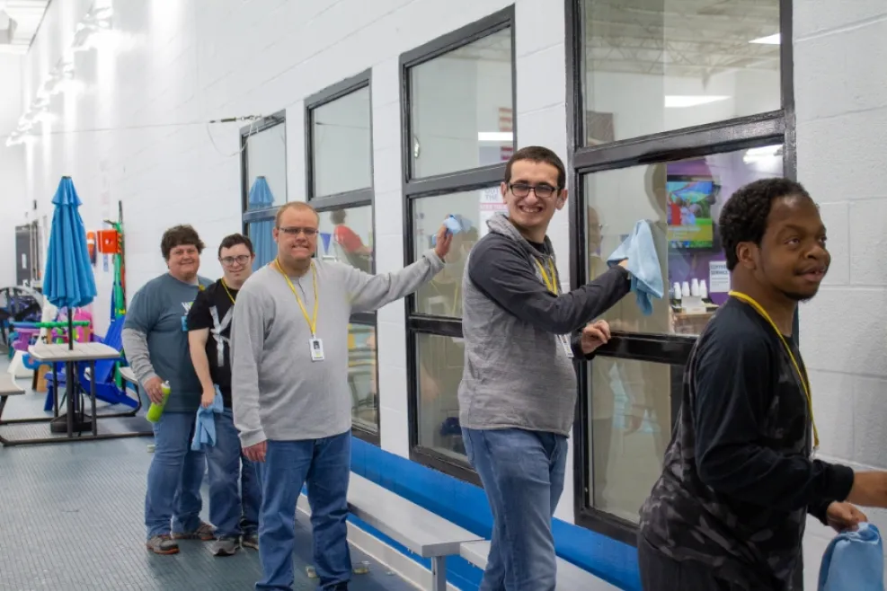 Group of People Cleaning Windows